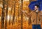 Man in Autumn with umbrella in forest