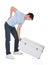 Man With Back Pain Lifting Metal Box