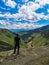 A man on the background of the Khunzakh Valley, Khunzakh waterfalls, Dagestan 2021