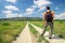 Man with a backpack on a country road. Man tourist.