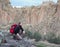 Man With Backpack Looking Over A Canyon