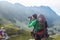 Man with backpack on the mountain. photographer