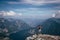 Man with a backpack takes in Austrian nature and a hallstatter see from Mount Krippenstein. A sense of relaxation and freedom. The