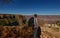 A man with a backpack visiting the Grand Canyon