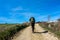 Man with Backpack is walking - The french Way of `Camino de Santiago` in Winter. Pilgrimages on their journey through Spain