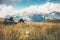 Man backpacker relaxing on grass valley at mountains