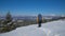 Man backpacker tourist walking snow landscape