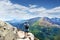 Man with backpacks hiking alone  on summer trip in mountains.