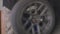 Man balances the wheel after tire fitting