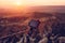 A man in a balloon takes a picture of the landscape of Cappadocia at dawn. Flight in a hot air balloon is one of the