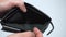 Man bankrupt arrears shows empty wallet with no money on white background