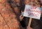 Man with banner Stop Spread. Man protests, calling governments to help fight corona virus. Person encourage scientists