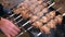 Man barbecuing on the grill, close-up. Barbecue outdoors