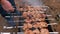 Man barbecuing on the grill, close-up. Barbecue outdoors