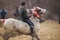 Man is bareback riding an adorned horse before an Epiphany celebration horse race