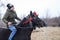 Man is bareback riding an adorned horse before an Epiphany celebration horse race