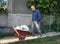 Man with barrow full of cement bags