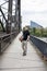 Man With a Basketball Posing Near Railway Tracks