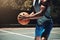 Man, basketball and running on court for training, workout and exercise in summer. Basketball player, basketball court