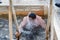 Man bathes into cold water of ice-hole on Epiphany day. Traditional ice swimming in Orthodox church Holy Epiphany Day. Russia
