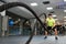 Man with battle ropes exercise in the fitness gym.