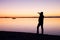 Man on beach photograph romantic morning at sea. Fantastic morning with smooth water level