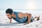 Man, beach and pushup on sand for workout, fitness or exercise for performance in summer sunshine. Young guy
