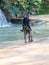 Man on beach with spear fishing catch