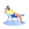 Man in Beachwear Sits on Chair Talking on Phone.