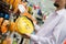 The man with beard buying yellow tow rope at the shopping store closeup on hand on the supermarket display shelf background