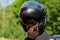 Man with a beard in a helmet. Close-up baker in a black helmet with a black beard