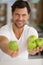 Man with beard holds apples