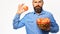 Man with beard holds wicker bowl with apple fruits