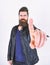 Man with beard and mustache on strict face shows index finger gesture, pointing, close up. Menswear and fashion concept