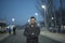 Man with a beard poses on winter day in outdoor nighttime image