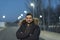 Man with a beard poses on winter day in outdoor nighttime image