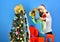 Man with beard ready to throw toy on blue background