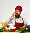 Man with beard shows Super Tasty sign on white background.