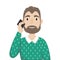 A man with a beard in a sweater over his shirt talking on a mobile phone