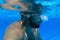 Man with Beard Underwater swimming pool Young beard man with glasses Underwater