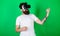 Man with beard in VR glasses, green background. Hipster guitarist on enthusiastic face use modern technology for