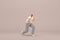 The man with beard wearinggray corduroy pants and white collar t-shirt. He is pulling or pushing something. 3d rendering of