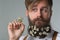 Man with beard in white shirt and suspenders