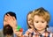 Man with beard, woman and boy play on blue background.