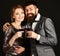 Man with beard and woman in shining dress celebrate