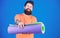 Man bearded athlete hold fitness mat. Fitness and stretching. Having good stretch. Athlete yoga coach motivated for