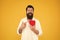 Man bearded hipster hold red heart. Prescribe medication lower blood pressure cholesterol. Feel pulse check heart rate