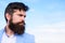 Man bearded hipster with mustache blue sky background. Ultimate mustache grooming guide. Expert tips for growing and