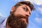 Man bearded hipster with mustache sky background. Check out my long beard. Ultimate moustache grooming guide. Hipster