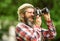 Man bearded hipster photographer hold vintage camera. Man with beard shooting photos. Photographer concept. Photographer